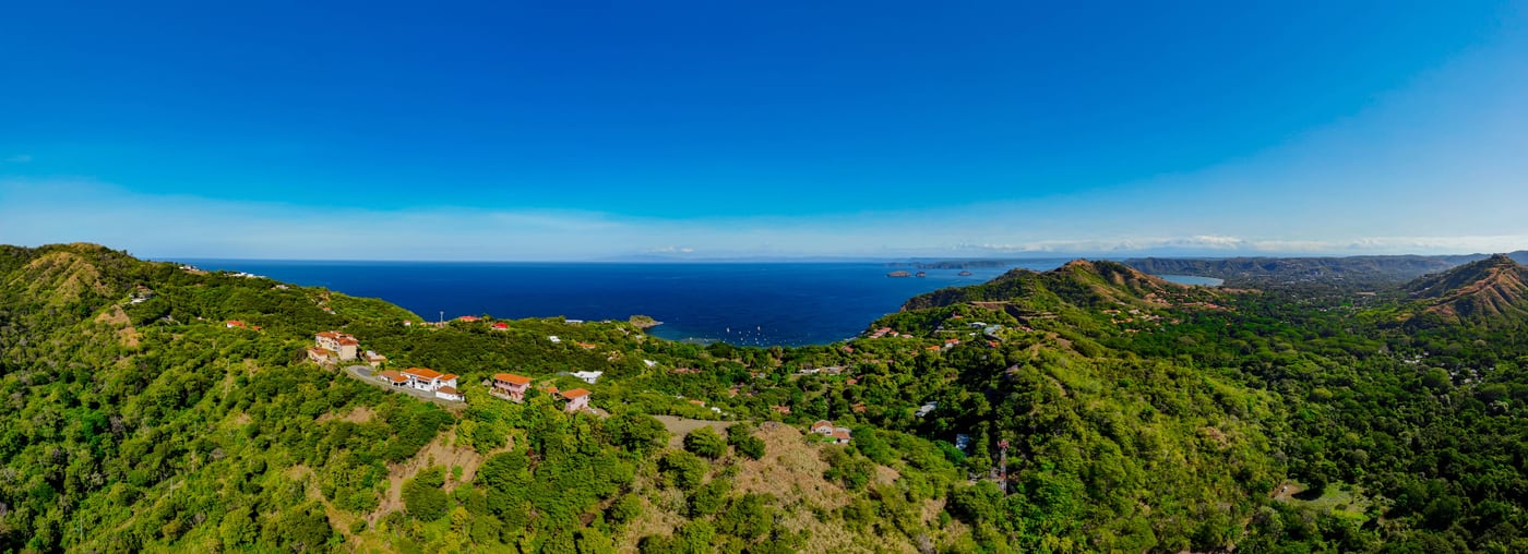 Wide view over the green hillsides above Ocotal with the Pacific beyond